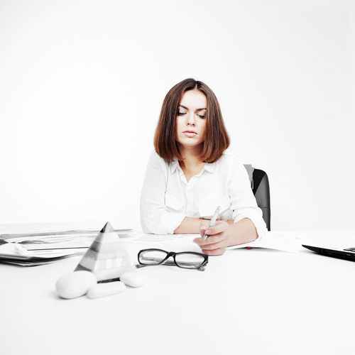 Businesswoman looking at documents on the desk Stock Photo 05