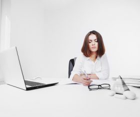 Businesswoman looking at documents on the desk Stock Photo 07