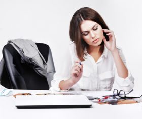 Businesswoman looking at documents on the desk Stock Photo 08