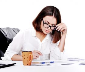 Businesswoman looking at documents on the desk Stock Photo 09