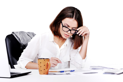 Businesswoman looking at documents on the desk Stock Photo 09