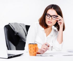 Businesswoman looking at documents on the desk Stock Photo 11