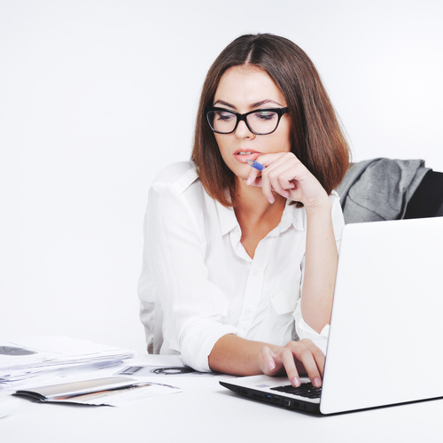 Businesswoman using laptop in office Stock Photo 01