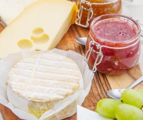 Cheese and jam on chopping board Stock Photo 01