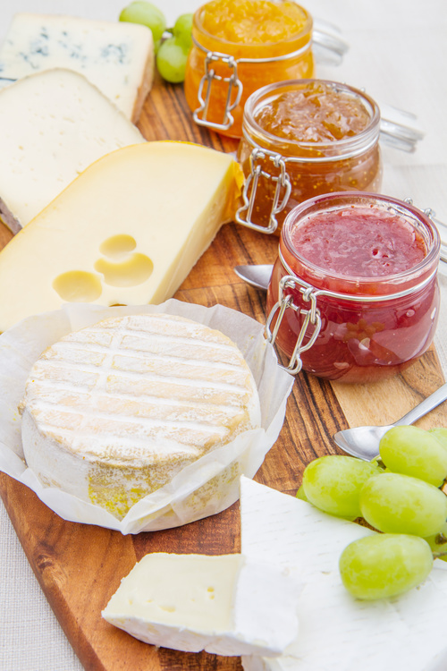 Cheese and jam on chopping board Stock Photo 01