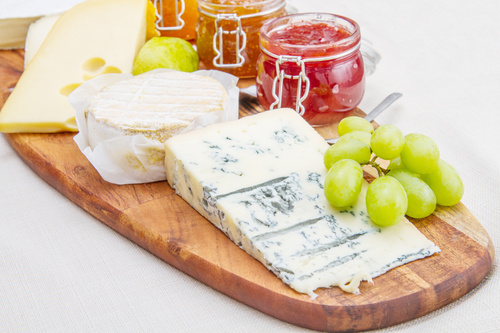 Cheese and jam on chopping board Stock Photo 02