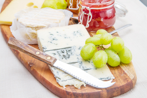 Cheese and jam on chopping board Stock Photo 03