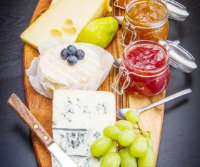 Cheese and jam on chopping board Stock Photo 04