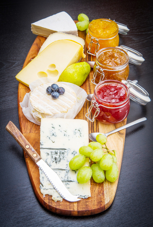 Cheese and jam on chopping board Stock Photo 04