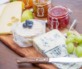 Cheese and jam on chopping board Stock Photo 05
