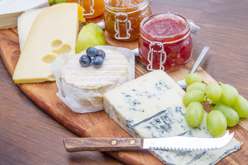 Cheese and jam on chopping board Stock Photo 05