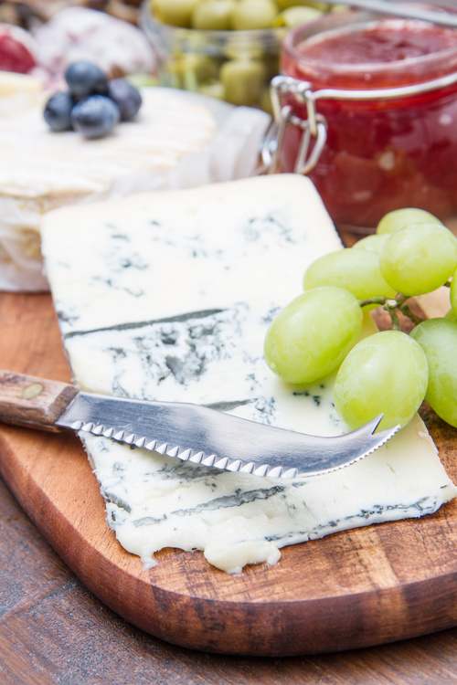 Cheese and jam on chopping board Stock Photo 06