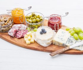 Cheese jam and sausage with pickled olives on cutting board Stock Photo 04