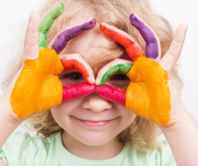 Child hands stained color pigments Stock Photo