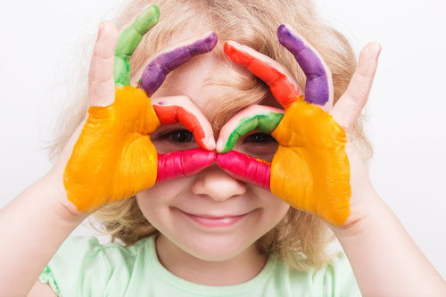 Child hands stained color pigments Stock Photo