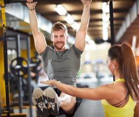 Couple doing sports in the gym Stock Photo 01