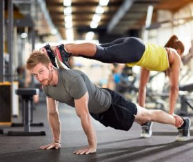 Couple doing sports in the gym Stock Photo 03