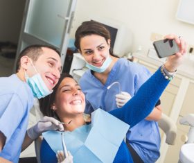 Dental patient and dentist taking pictures Stock Photo