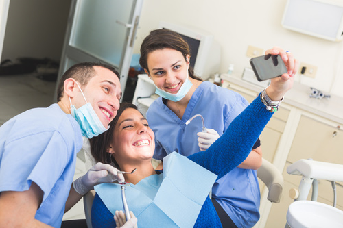 Dental patient and dentist taking pictures Stock Photo