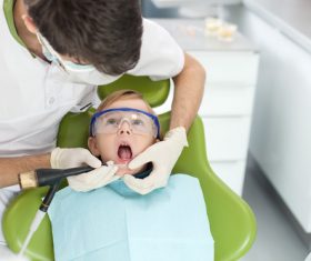 Dentist examines childrens teeth Stock Photo 02