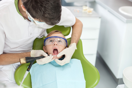 Dentist examines childrens teeth Stock Photo 02