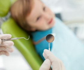 Dentist holding a checkup dental equipment Stock Photo