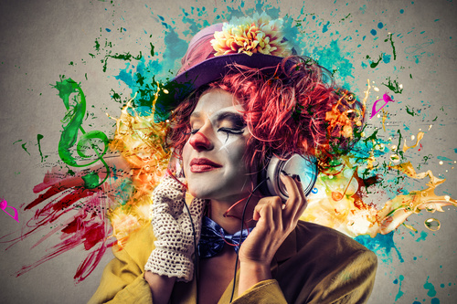 Female funny clown shape listening to music Stock Photo