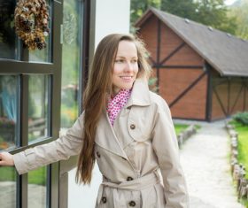 Female opening the door Stock Photo