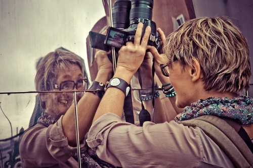 Female photographer framing Stock Photo