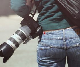 Female photographer waist camera Stock Photo