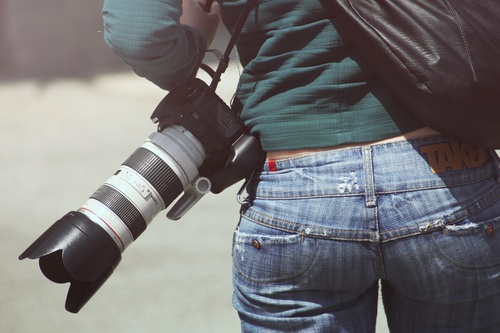 Female photographer waist camera Stock Photo