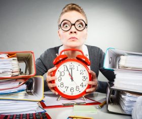 Female secretary and alarm clock Stock Photo 02