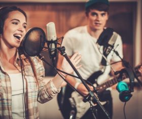Female singer recording in the recording studio Stock Photo