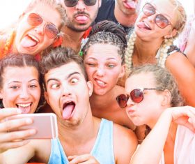 Funny expressions of young friends taking selfies Stock Photo