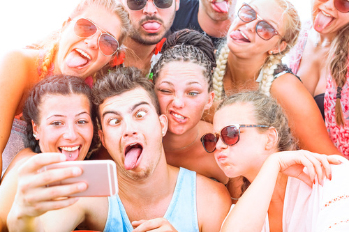 Funny expressions of young friends taking selfies Stock Photo