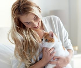 Girl holding a cat Stock Photo