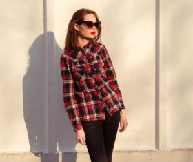 Girl in red plaid shirt wearing sunglasses Stock Photo