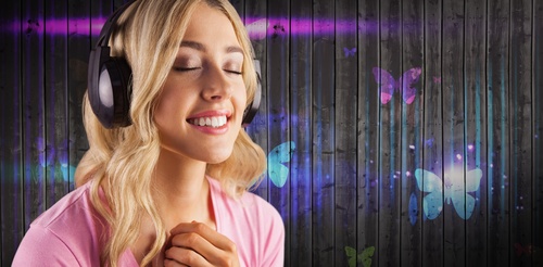 Girl listening to music standing in front of cartoon painted wall background Stock Photo 02