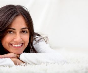 Girl lying on the carpet Stock Photo 02