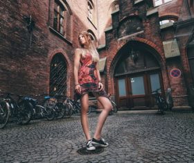 Girl posing in front of an ancient building Stock Photo