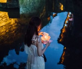 Girl putting river lights Stock Photo