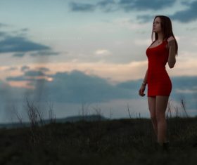 Girl wearing red short dress outdoors Stock Photo