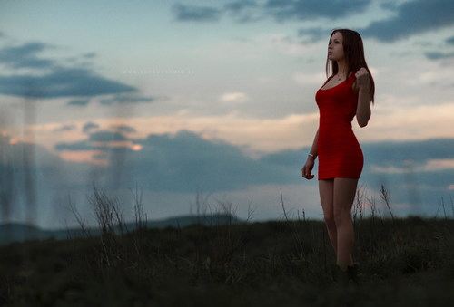 Girl wearing red short dress outdoors Stock Photo