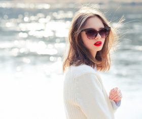 Girl with sunglasses and red lipstick on the lakeside Stock Photo