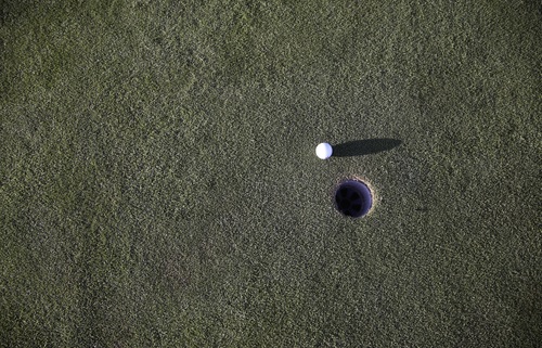 Golf ball and hole Stock Photo 01