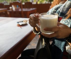 Hand holding a glass of milk Stock Photo 02