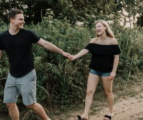 Happy couple holding hands Stock Photo