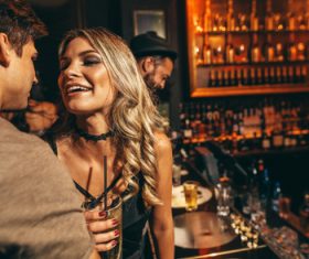 Happy men and women in front of the bar Stock Photo 02