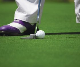 Hitting golf balls Stock Photo