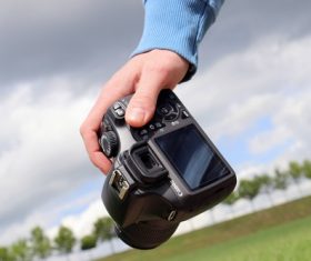 Holding digital camera Stock Photo 01